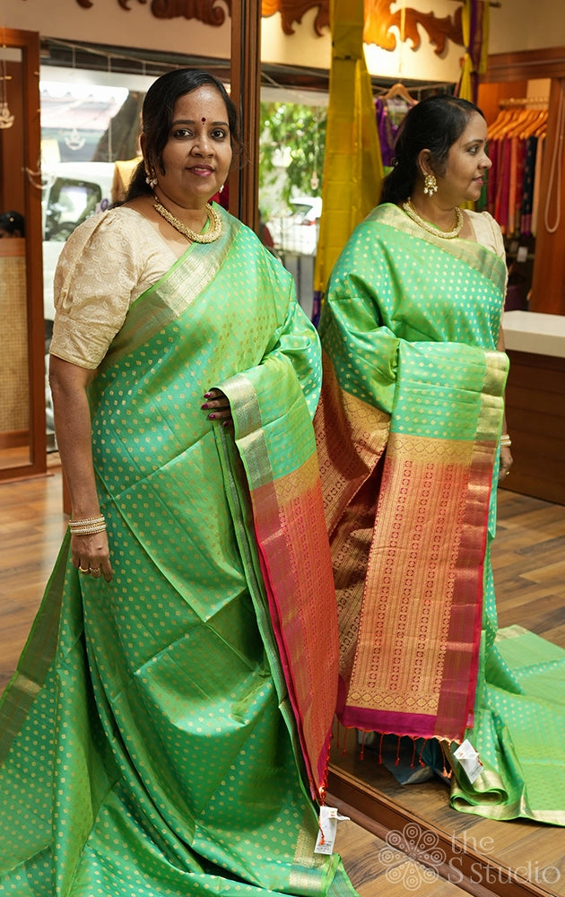 Parrot green soft silk saree with small butta